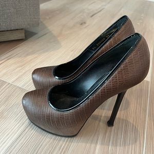 Brown and black YSL pumps